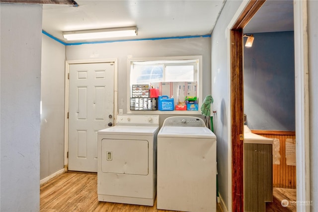 washroom featuring light wood-type flooring and washer and dryer