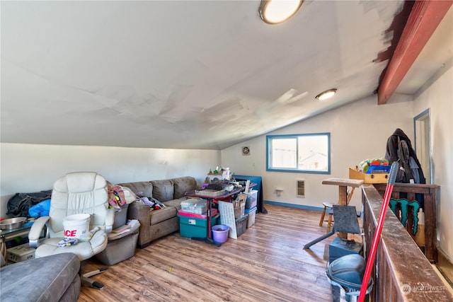 living room with hardwood / wood-style floors and lofted ceiling