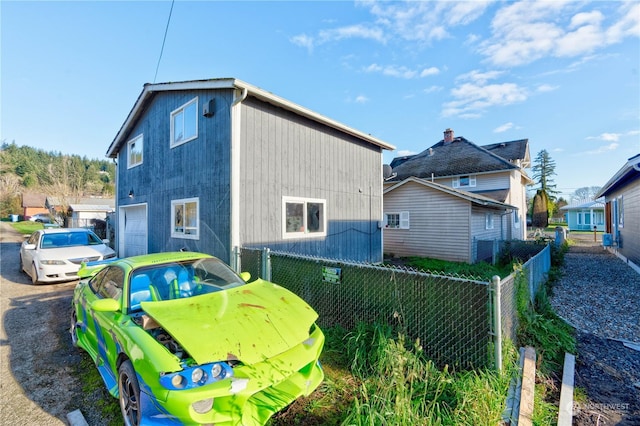 view of side of home with a garage