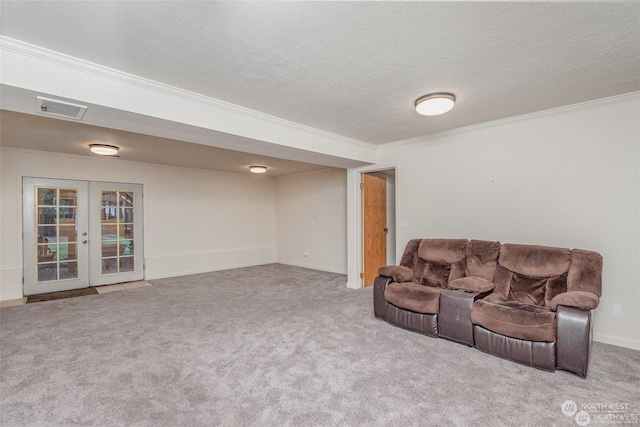 carpeted living room featuring a textured ceiling, crown molding, and french doors