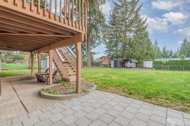 view of patio / terrace featuring a storage shed