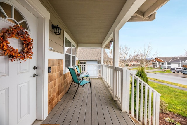 wooden terrace featuring covered porch