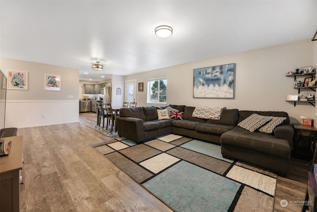 living room with light hardwood / wood-style flooring