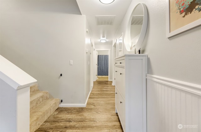 hall with light hardwood / wood-style flooring