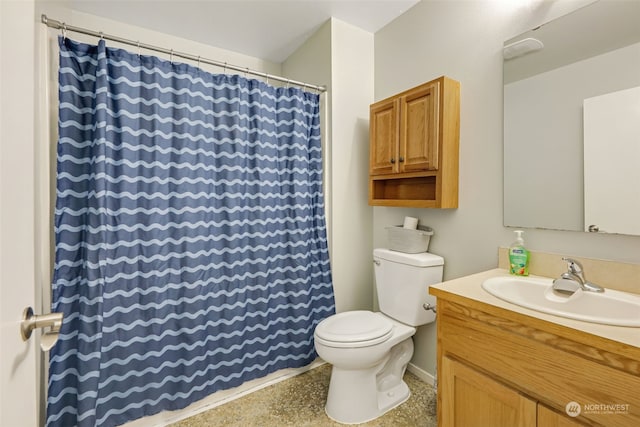 bathroom featuring toilet and vanity