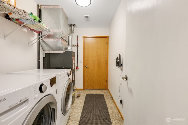 laundry area with washing machine and clothes dryer