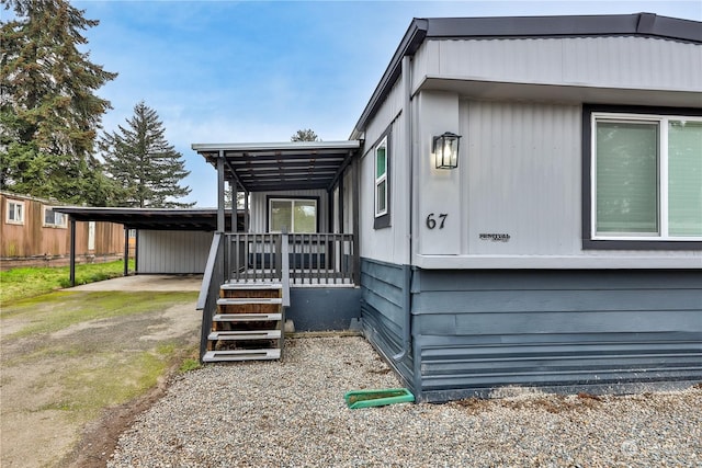 view of side of property with a carport