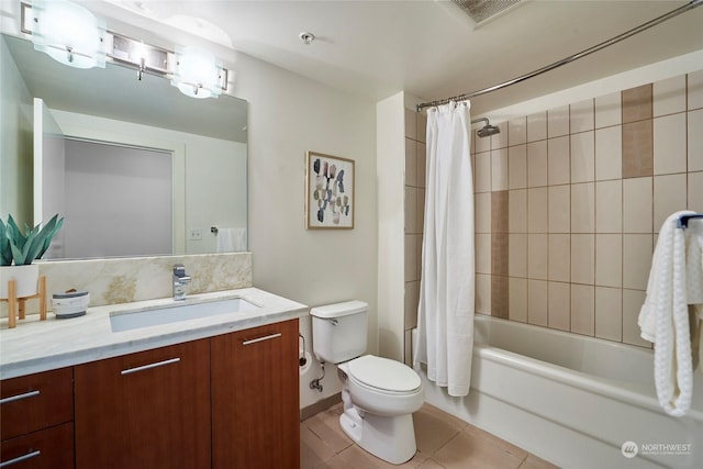 full bathroom featuring toilet, tile patterned flooring, vanity, and shower / bathtub combination with curtain