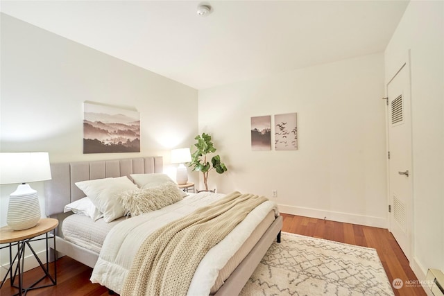 bedroom featuring wood-type flooring