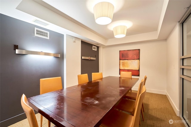 dining area featuring carpet flooring