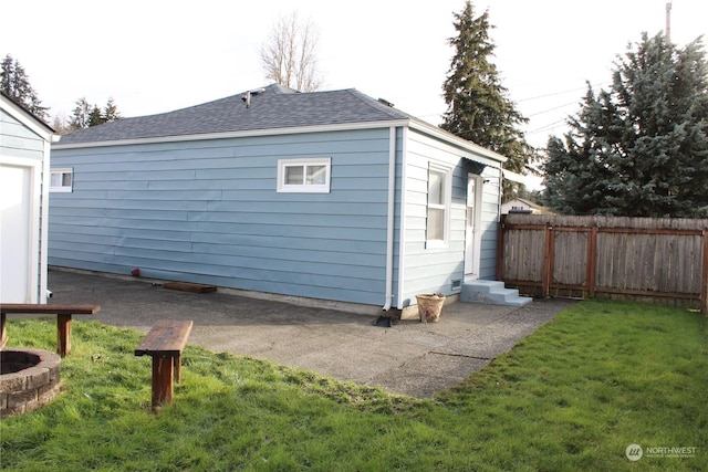 rear view of house featuring a yard