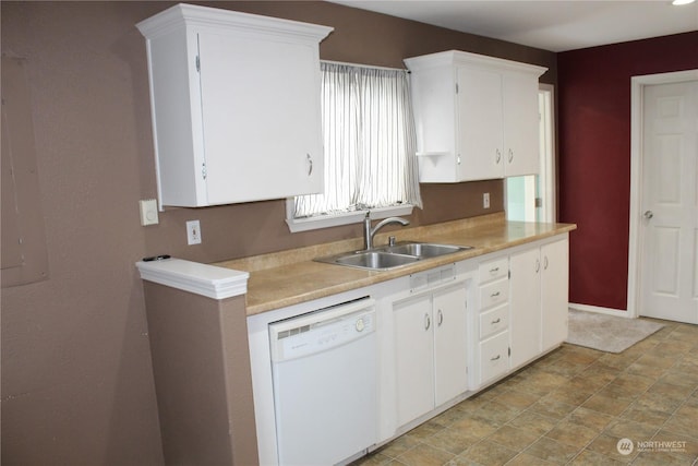 kitchen with sink, white cabinets, and white dishwasher