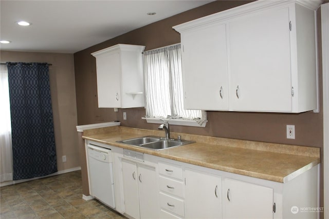 kitchen featuring recessed lighting, light countertops, white cabinetry, a sink, and dishwasher