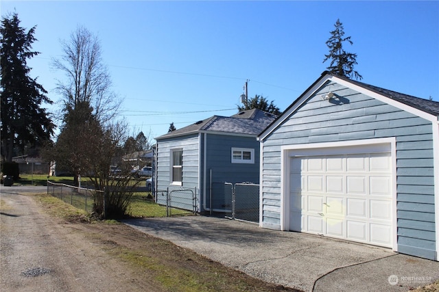 detached garage with fence