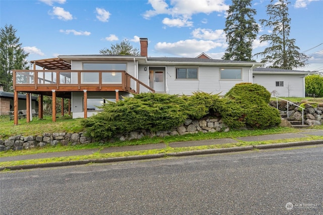 view of front of property featuring a deck