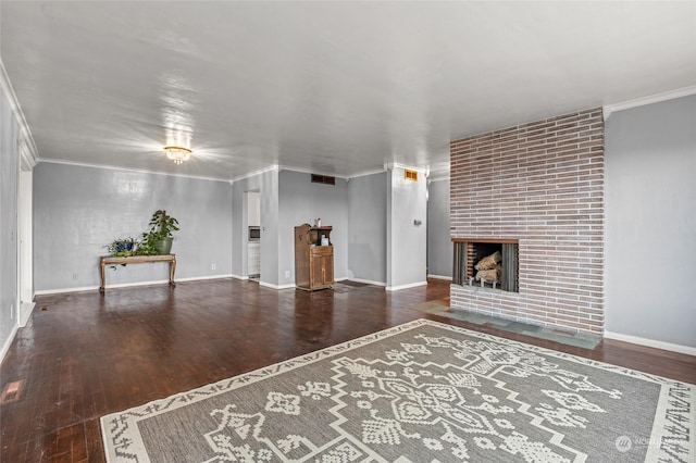 unfurnished living room featuring crown molding, a fireplace, and dark hardwood / wood-style floors