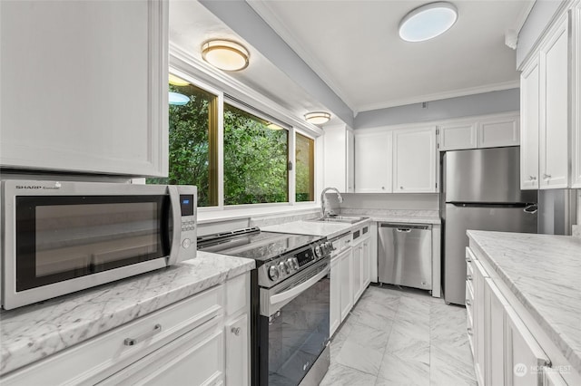 kitchen with white cabinets, sink, crown molding, appliances with stainless steel finishes, and light stone counters