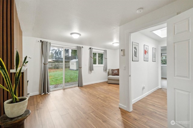 entryway featuring a textured ceiling and wood-type flooring