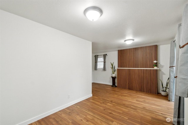 unfurnished room with light hardwood / wood-style flooring