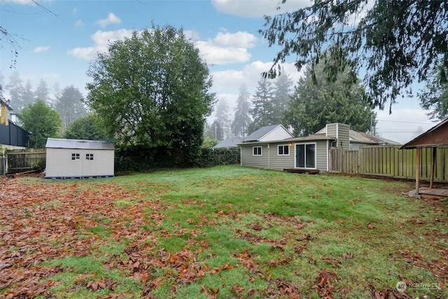 view of yard with a storage unit