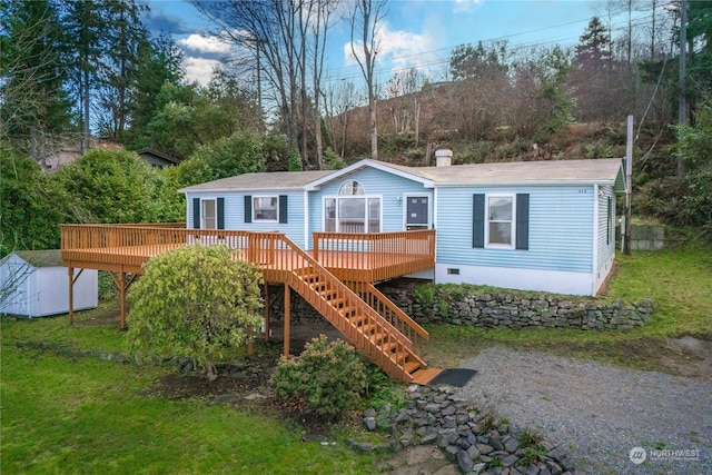 exterior space with a deck and a storage shed