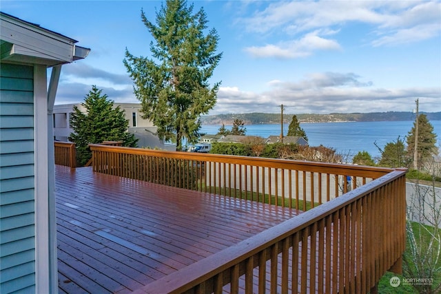 deck featuring a water view