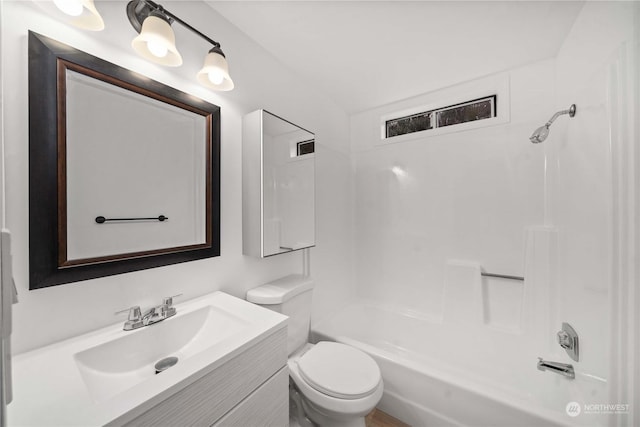 full bathroom featuring bathtub / shower combination, vanity, and toilet