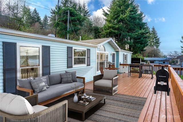 wooden deck with an outdoor hangout area