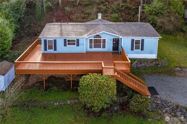 view of front of home featuring a wooden deck