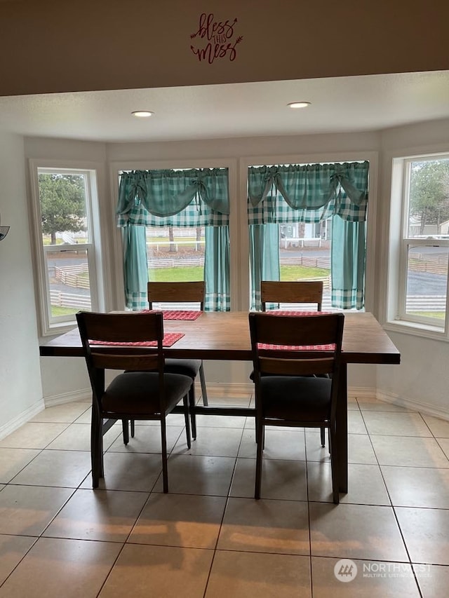 tiled dining space with plenty of natural light