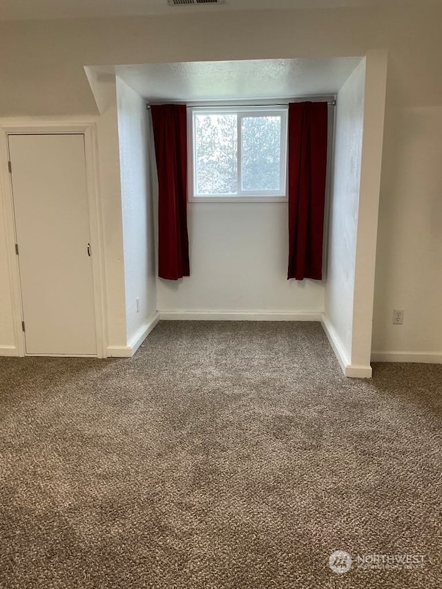 empty room with carpet flooring