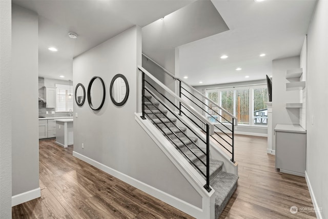 stairway featuring hardwood / wood-style floors