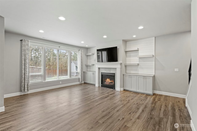 unfurnished living room with light hardwood / wood-style floors