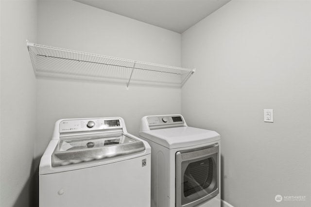 laundry room with separate washer and dryer