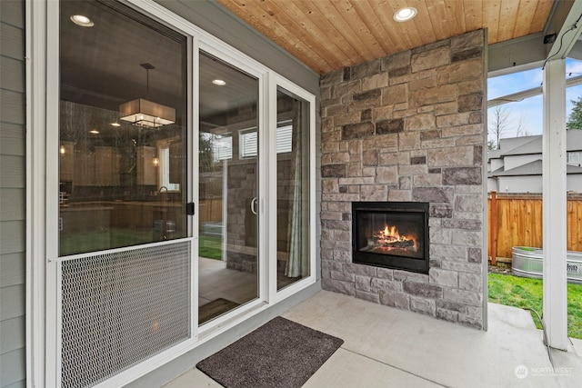 view of patio with an outdoor stone fireplace