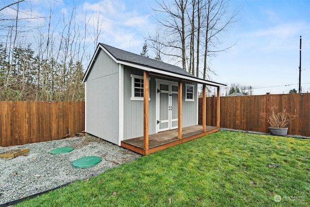 view of outbuilding featuring a lawn