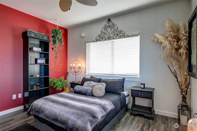 bedroom featuring dark hardwood / wood-style flooring and ceiling fan