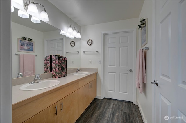 bathroom featuring hardwood / wood-style floors and vanity