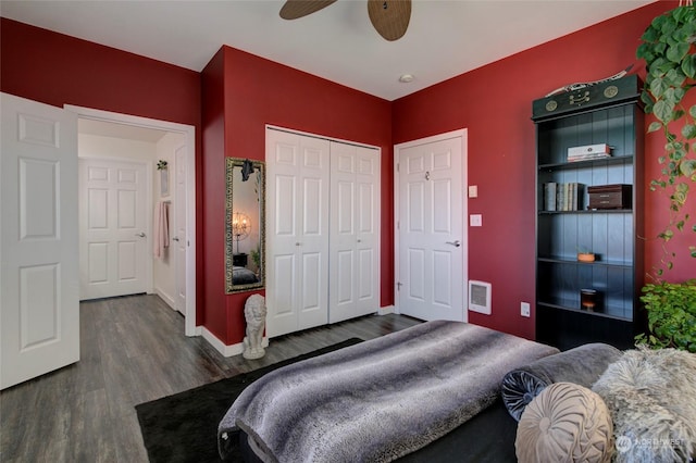 bedroom with dark wood-type flooring, ceiling fan, and a closet