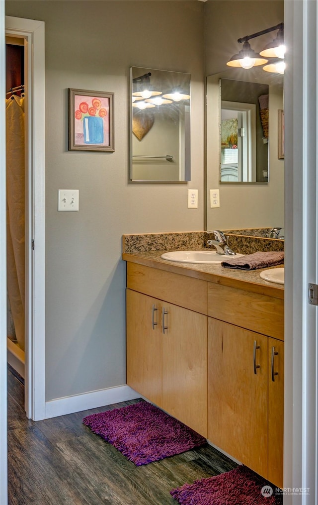 bathroom featuring vanity and hardwood / wood-style flooring