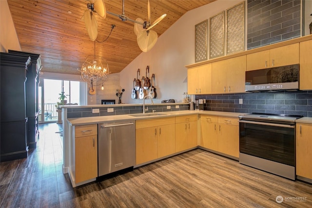 kitchen with kitchen peninsula, stainless steel appliances, light brown cabinetry, wood ceiling, and tasteful backsplash