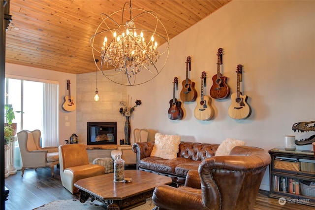 living room featuring lofted ceiling, wood-type flooring, wooden ceiling, and a fireplace