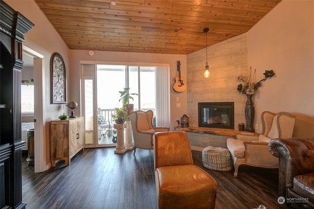 sitting room featuring lofted ceiling, a tile fireplace, wooden ceiling, and dark hardwood / wood-style floors