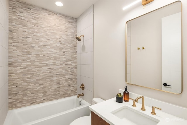 full bathroom with vanity, toilet, and tiled shower / bath