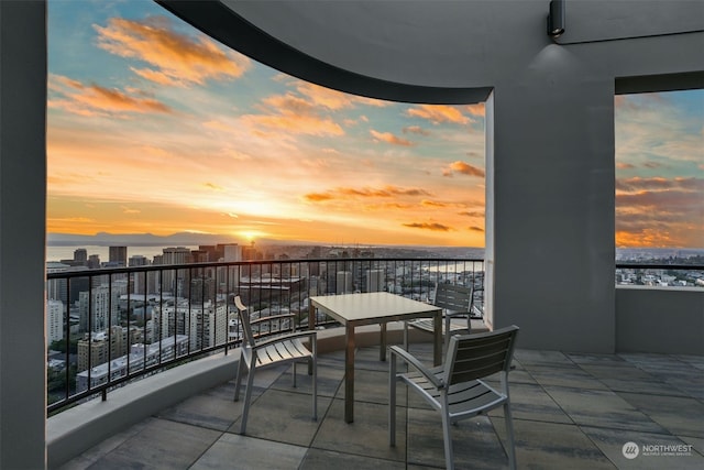 balcony at dusk with a water view