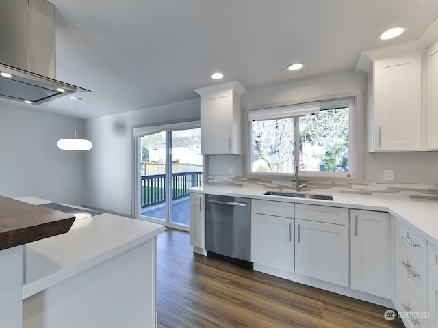 kitchen featuring white cabinetry, pendant lighting, a wealth of natural light, and stainless steel dishwasher