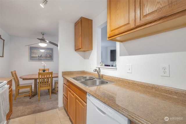 kitchen featuring sink, dishwasher, ceiling fan, light tile patterned floors, and stove