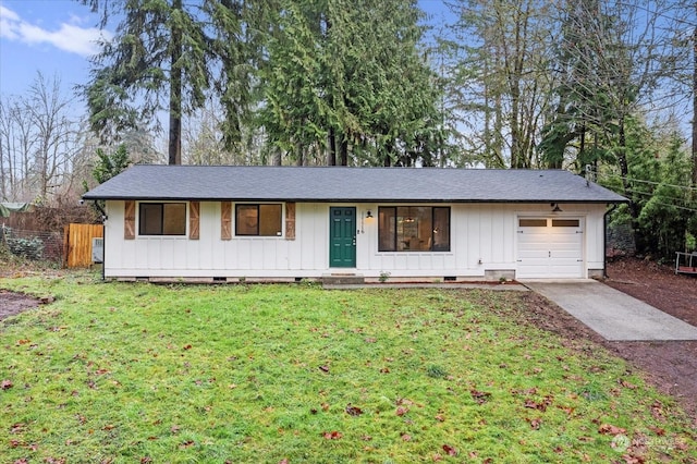 ranch-style house with a front yard and a garage