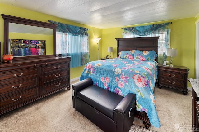 bedroom featuring light carpet