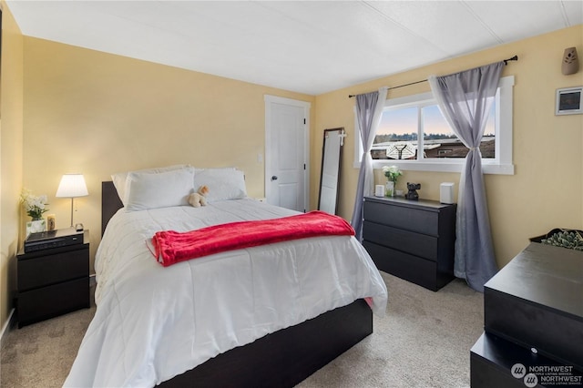 bedroom with light colored carpet